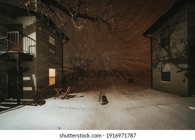 Austin, Texas - Feb 15, 2021: Nightview Of The Blizzard In Austin, Texas. The Snow Is Blowing Strongly. The Road Is Covered By Snow.