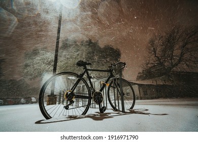 Austin, Texas - Feb 15, 2021: Nightview Of The Blizzard In Austin, Texas. The Snow Is Blowing Strongly. The Road Is Covered By Snow.