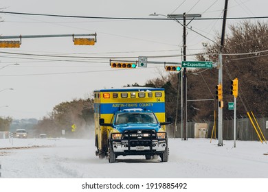 Austin, Texas - Feb 16, 2021: The Day After The Blizzard In Austin, Texas, The Ambulance Is Driving On The Way With Snow.