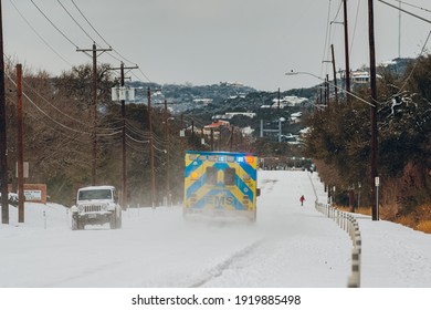 Austin, Texas - Feb 16, 2021: The Day After The Blizzard In Austin, Texas, The Ambulance Is Driving On The Way With Snow.