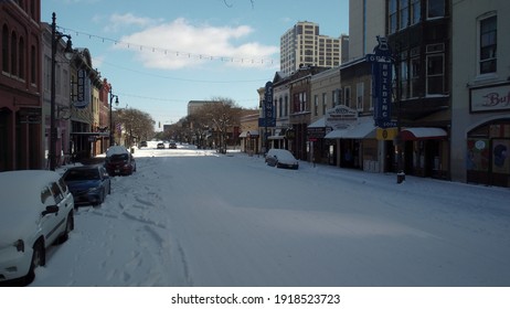 Austin, Texas - February 15, 2021: Snow Covers A Frozen 6th Street In The Downtown Nightlife District