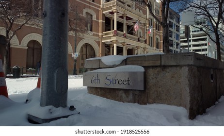 Austin, Texas - February 15, 2021: The 6th Street Sign Covered In Winter Snow After A Texas Blizzard