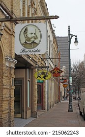 AUSTIN, TEXAS - FEBRUARY 3 2014: Bars, Restaurants And Other Businesses In The Sixth Street Historic District, A Major Tourist Destination That Is Listed In The National Register Of Historic Places.