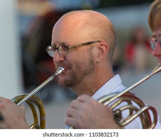 AUSTIN, TEXAS - JUNE 1 2014: Closeup Of A French Horn Player At An Outdoor Concert