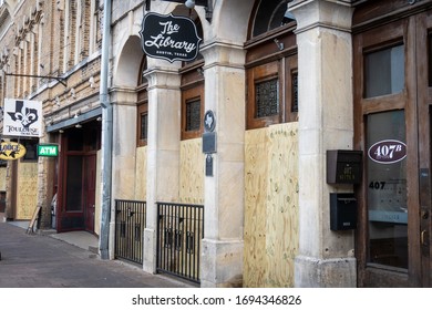Austin, Texas March 19 2020: Boarded Up Bar, The Aquarium, Closed Due To The COVID-19 Outbreak Up Along 6th Street After Mayor Steve Adler Ordered All Restaurant, Bars, And Other Businesses To Close