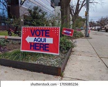 Austin, Texas March 3 2020: Bilingual Voting Signs Point To Polling Place 