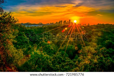Austin Texas nature trail hiking at sunrise with golden hour sunburst glowing over the city skyline cityscape amazing fine arts photography
