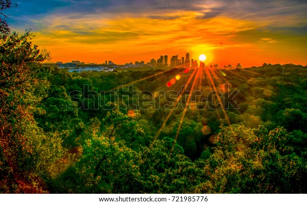 Austin Texas nature trail hiking at sunrise\
with golden hour sunburst glowing over the city skyline cityscape\
amazing fine arts\
photography