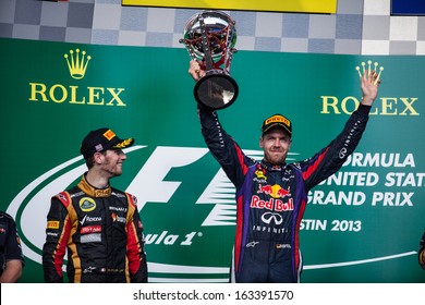 AUSTIN, TEXAS - NOVEMBER 17.  Winner Sebastian Vettel Holding Up His Trophy On The Podeum After The Formula 1 United States Grand Prix On November 17, 2013 In Austin, Texas. 