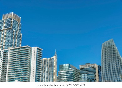 Austin Texas Skyline With Luxury Apartments Facade Against Blue Sky Background. Exterior Of Expensive Residential Buildings With Modern Housing Architecture Designs.