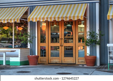 Austin, Texas / United States - August 2, 2015: Clark's Oyster Bar Restaurant Front Entrance With Striped Awning On West 6th Street