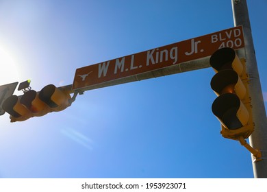 Austin, Texas U.S.A. - April 11, 2021: Martin Luther King Boulevard Street Sign At Traffic Light