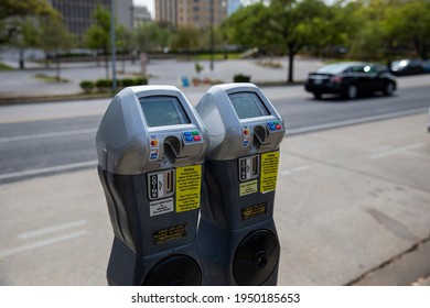 Austin, Texas U.S.A. - April 4, 2021: Parking meters in the street