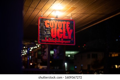 Austin, Texas / USA - Dec. 30, 2019: A View Of The Entrance To The Coyote Ugly Saloon At Nighttime. The Saloon Is Part Of A Row Of Bars And Restaurants On The Famous Sixth Street, A Nightlife Area.