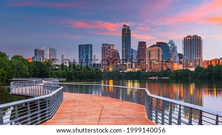 Austin, Texas, USA downtown skyline over the Colorado River at dawn.
