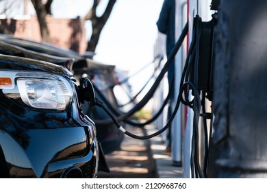 Austin , Texas , USA - February 1st 2022: Electric Vehicles Charging At Electric Car Charging Station