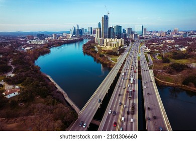 Austin Texas USA A Gorgeous Capital City Of Texas Aerial Drone Views Above Coloradp River And Interstate 35 And Tall Skyscrapers Growing Cityscape , Traffic , And Perfect Sunny Weather