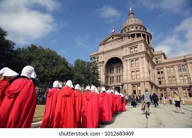 Austin, Texas / USA - Jan. 20, 2017: Women dressed in "Handmaids Tale" costumes arrive at the Capitol for a rally at the end of a reproductive rights march from city hall.