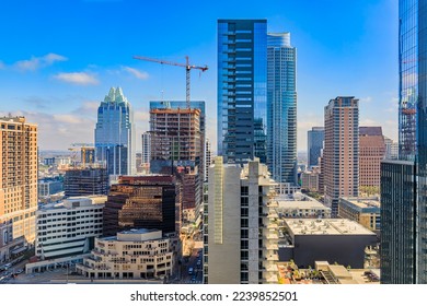 Austin, Texas, USA - January 27, 2020: Modern skyscraper buildings, offices of tech firms downtown with the famous Frost Bank Tower in the background
