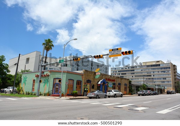 AUSTIN, TEXAS, USA - MAY 17, 2015. Street view in\
Austin, with residential and commercial buildings, commercial\
properties and cars.