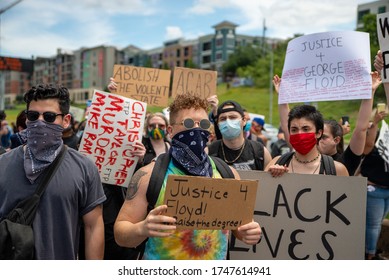 Austin, Texas / USA - May 30, 2020: Protesters demonstrating against police brutality overtake Interstate 35 in Downtown Austin, TX. 