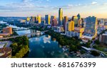 Austin Texas USA sunrise skyline cityscape over Town Lake or Lady Bird Lake with amazing reflection. Skyscrapers and Texas capital building in distance you can see the entire city during summer