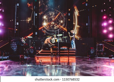 AUSTIN, TX / USA - August 2nd, 2018: Dan Reynolds (left), Daniel Platzman (center), Ben McKee (right) Of Imagine Dragons Performs Onstage At Austin360 Amphitheater.