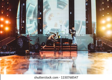 AUSTIN, TX / USA - August 2nd, 2018: Dan Reynolds (left), Daniel Platzman (center), Ben McKee (right) Of Imagine Dragons Performs Onstage At Austin360 Amphitheater.