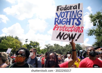 Austin, TX, USA - July 31, 2021: A young Black woman  demonstrator at a rally at the Capitol protests voting rights limitations contained in bills written by Republicans in the state legislature .