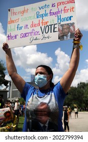 Austin, TX, USA - July 31, 2021: A woman  demonstrator at a rally at the Capitol protests voting rights limitations contained in bills written by Republicans in the state legislature.