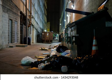 Austin, TX / USA - Jun 8, 2019: Back Alley Trash Left Out After Homeless Dumpster Diving.