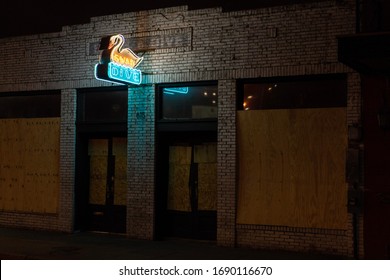 Austin, TX / USA - March 24 2020: The Popular Local Bar Swan Dive Is Closed And Boarded Up During The Coronavirus Pandemic.