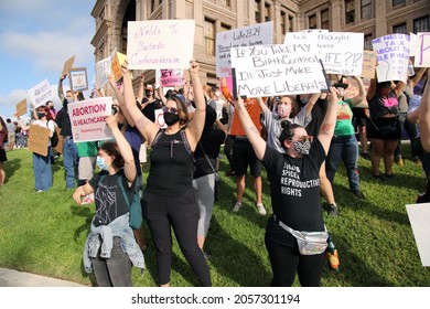 Austin, TX, USA - Oct. 2, 2021: Women participants at the Women's March rally at the Capitol protest SB 8, Texas' abortion law that effectively bans abortions after six weeks of pregnancy.