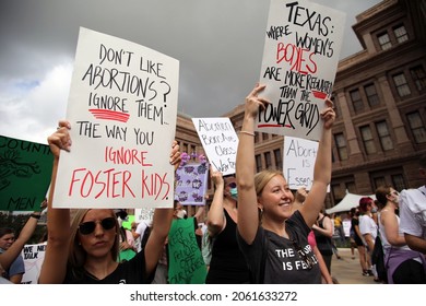Austin, TX, USA - Oct. 2, 2021:  Women participants at the Women's March rally at the Capitol protest SB 8, Texas' abortion law that effectively bans abortions after six weeks of pregnancy.
