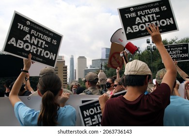 Austin, TX, USA-Oct. 2, 2021: Pro-life counter protesters at the Women's March pro-choice rally at the Capitol support Texas' abortion law that effectively bans abortions after six weeks of pregnancy.