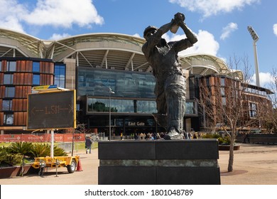 Australia; August 2020: Statue Of A Football Player In Front Of The Adelaide Oval. People Entering The Stadium Before An Australian Football Match. Team Adelaide Crows. Adelaide, South Australia