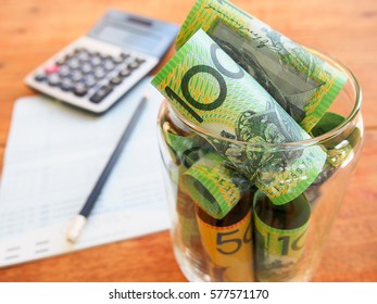 Australia Bank Note,,account Book And Calculator In  Saving Money Concept