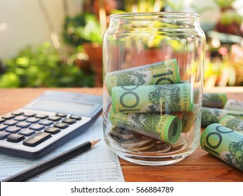 Australia bank note,coins,account book and calculator in  saving money concept