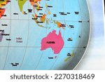 Australia continent surrounded by the Indian ocean and New Zealand, Indonesia, Malaysia,  Singapore and other countries from the world Earth map, Travel, education, worldwide concept, selective focus
