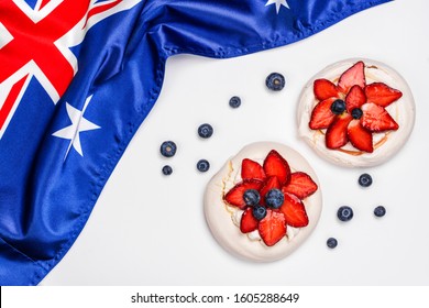 Australia Day. Australia National Day Background With Australia National Flag, Dessert Pavlova Cakes On White. Copy Space