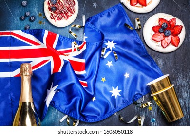 Australia Day. Australia National Day background with Australia National Flag, dessert pavlova cakes on white. Copy space