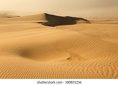 Australia Dry Desert Sand Dune In NSW Day Time With Dust Storm Approaching Over Waves Of Lifeless Sand