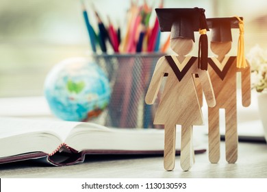 Australia Education knowledge learning study abroad international Ideas. People Sign wood with Graduation celebrating cap on open textbook with model global map, alternative studying world wide - Shutterstock ID 1130130593