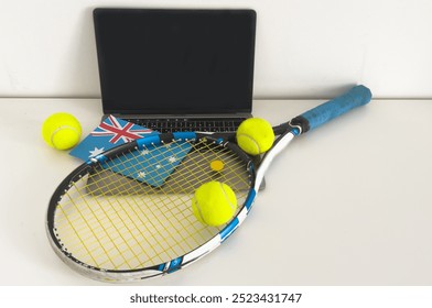 Australia flag concept with tennis racket and laptop on top view.  - Powered by Shutterstock