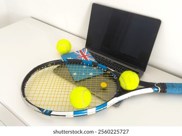 Australia flag concept with tennis racket and laptop on top view.  - Powered by Shutterstock