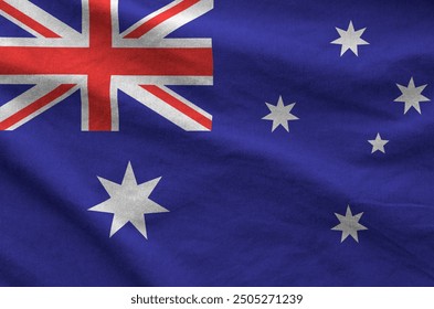 Australia flag depicted on folded wavy fabric of old cloth close up - Powered by Shutterstock