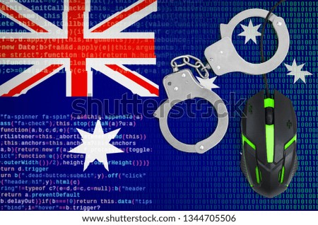 Australia flag  and handcuffed computer mouse. Combating computer crime, hackers and piracy