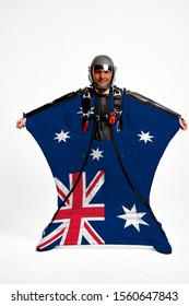 Australia Flag Travel. Bird Men In Wing Suit Flag. Sky Diving Men In Parashute. Patriotism, Men And Flag.
                               