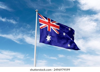 Australia flag waving at cloudy sky background. the Commonwealth of Australia flag - Powered by Shutterstock