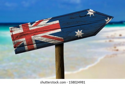 Australia Flag Wooden Sign With A Beach On Background - Oceania